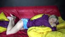 Watching sexy Sonja weraing a sexy down skirt and a down jacket putting on a sexy purple rainsuit (Video)