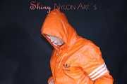 Watching Pia putting on a wonderful supersexy shiny nylon rainssuit in orange (Pics)