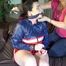 Jill tied and gagged on bed with chains and cuffs wearing shiny nylon shorts and a rain jacket (Video)
