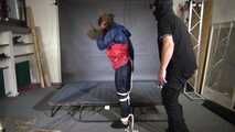 Marie bound and gagged in shiny nylon Rainwear
