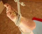 Tapegagged toples barefoot Doris, bound on the floor, suspended by one foot