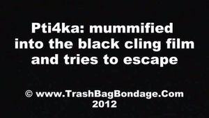 [From archive] Pti4ka mummified in black cling film (video)