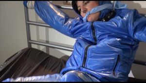 Mara tied, gagged and hooded on bed with cuffs wearing a sexy blue downwear combination (Video)