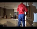 Watch Sonja to dress herself with rainwear and begin her workout on the home trainer (Video)
