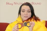 Jill ties, gagges and hoodes herself wearing a shiny yellow down jacket and a yellow rain pants(Pics)