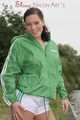 Watching ***OUR SEXY ARCHIVE MODEL JENNY*** wearing a sexy white shiny nylon shorts and a green shiny nylon rain jacket posing for you (Pics)