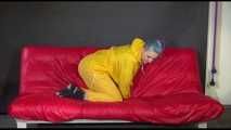 Watching Mara putting on sexy yellow shiny nylon rainwear lolling on the sofa (Video)