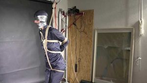 Myxxxy bound and gagged in a shiny nylon Rainsuit