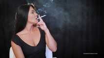 Delicious lady Tanya is engrossed in smoking a 120mm cigarette