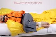 Samantha tied and gagged wearing shiny nylon rainwear (Pics)