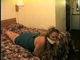 BBW MICHELLE IS WRAP VET TAPE GAGGED, CLEAVE GAGGED, BAREFOOT, TOE-TIED & BOUND UP ON THE BED (D47-13)