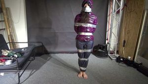 Aiyana bound, gagged, vibed and satisfied :) in a shiny nylon Downjacket