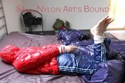 Mara tied and gagged on bed wearing a sexy shiny red down jacket and a blue rain pants (Pics)