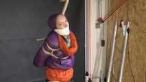Rachel Adams bound, gagged and double hooded in shiny downjackets