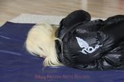 Nina tied and gagged in a shiny downjacket and rainpants