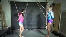 Aiyana and Ms Ungeniert in shiny nylon Shorts and Windbreaker tied and gagged together