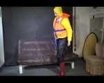 Sexy Mara trying on her new yellow down jacket and her lifevest in combination with a sexy shiny black rain pants and rubber boots (Video)