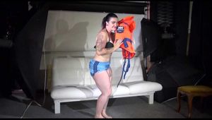 Sexy Jill shows you how to enjoy putting on and wear a lifevest over an bikini and a shiny nylon shorts (Video)