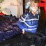 Pia tied, gagged and hooded in bed wearing a sexy shiny black rain pants and a blue/black down jacket (Pics)