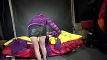 Watching sexy Sonja weraing a sexy down skirt and a down jacket putting on a sexy purple rainsuit (Video)