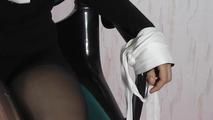 Isi tied up on the chair with towels 2/2
