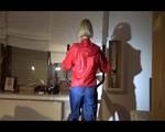Watch Sonja to dress herself with rainwear and begin her workout on the home trainer (Video)