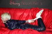 Sexy Courtney being tied and gagged with ropes and a ballgag on a bed wearing dark blue rainwear (Pics)