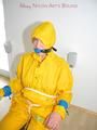 Katharina tied, gagged and hooded on a chair wearing sexy yellow rainwear (Pics)