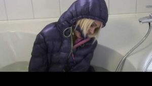 03:00 Min. video with Nina tied and gagged in a shiny nylon downjacket