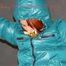 Sonja tied and gagged over her head on the arms wearing a sexy white shiny nylon skirt and a green down jacket (Pics)