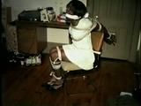 BLACK BANK TELLER IS MOUTH STUFFED, CLEAVE GAGGED & ROPE TIED TO CHAIR  (D46-2)