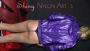 Watching sexy Pia putting on a sexy shiny crazy sensation donwbib in red and a black shiny nylon down jacket (Pics)