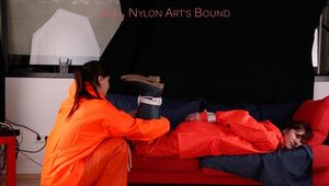 Julia tied and gagged by Alina in heavy raingear
