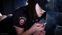 Police woman is smoking 3 strong reds in the studio