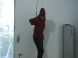Video with one of our archive girls tied and gagged in shiny nylon rainwear