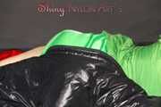 Lucy wearing sexy green shiny nylon shorts and a green rain jacket lolling on bed with a special cover (Pics)
