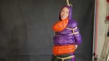 Rachel Adams bound, gagged and double hooded in shiny downjackets