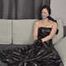 Bound and gagged in a long PVC dress