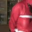 one of our archive girl tied and gagged in a shiny nylon rainsuit