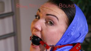 Jill ties, gagges and hoodes herself on bed wearing a supersexy lightblue downwear comnbination (Pics)