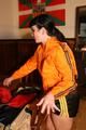 Jill wearing a sexy black nylon shorts and a orange rain jacket while dressing her up (Pics)