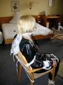 One of our archive girls tied and gagged in a shiny black PVC saunasuit