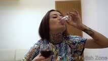 A hot chick with a suitcase makes a drinking test