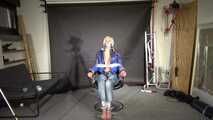 Alice bound and gagged in a shiny nylon Downjacket