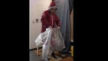 Lady Nadja in layers of AGU rainwear and and transparent raincoat
