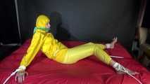 Watching sexy Pia being tied and gagged with ropes on a bed and a clothgag wearing sexy yellow shiny nylon rainwear (Video)