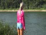 Watch Chloe enjoying her shiny nylon Shorts outside at a sunny Day