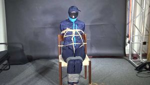 Marie bound and gagged in shiny nylon Rainwear