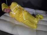 Watch Pia enjoying Bondage in her shiny nylon yellow Rainwear