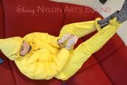 Jill ties, gagges and hoodes herself wearing a shiny yellow down jacket and a yellow rain pants(Pics)